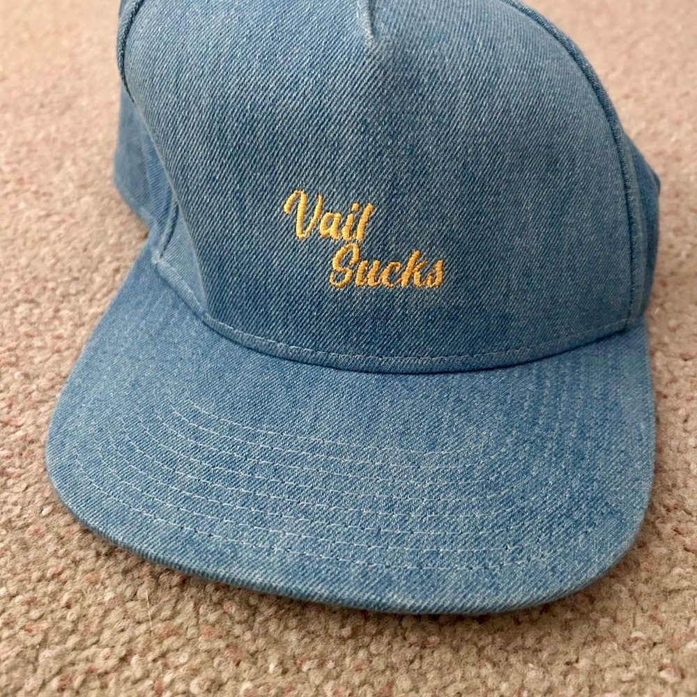 “Vail sucks”.  Blue hat.